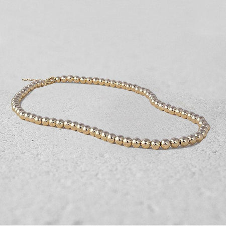 Dainty Gold Filled Beaded Necklace with Horse Shoe Charm and Cubic Zirconia for Women by Isabella Celini