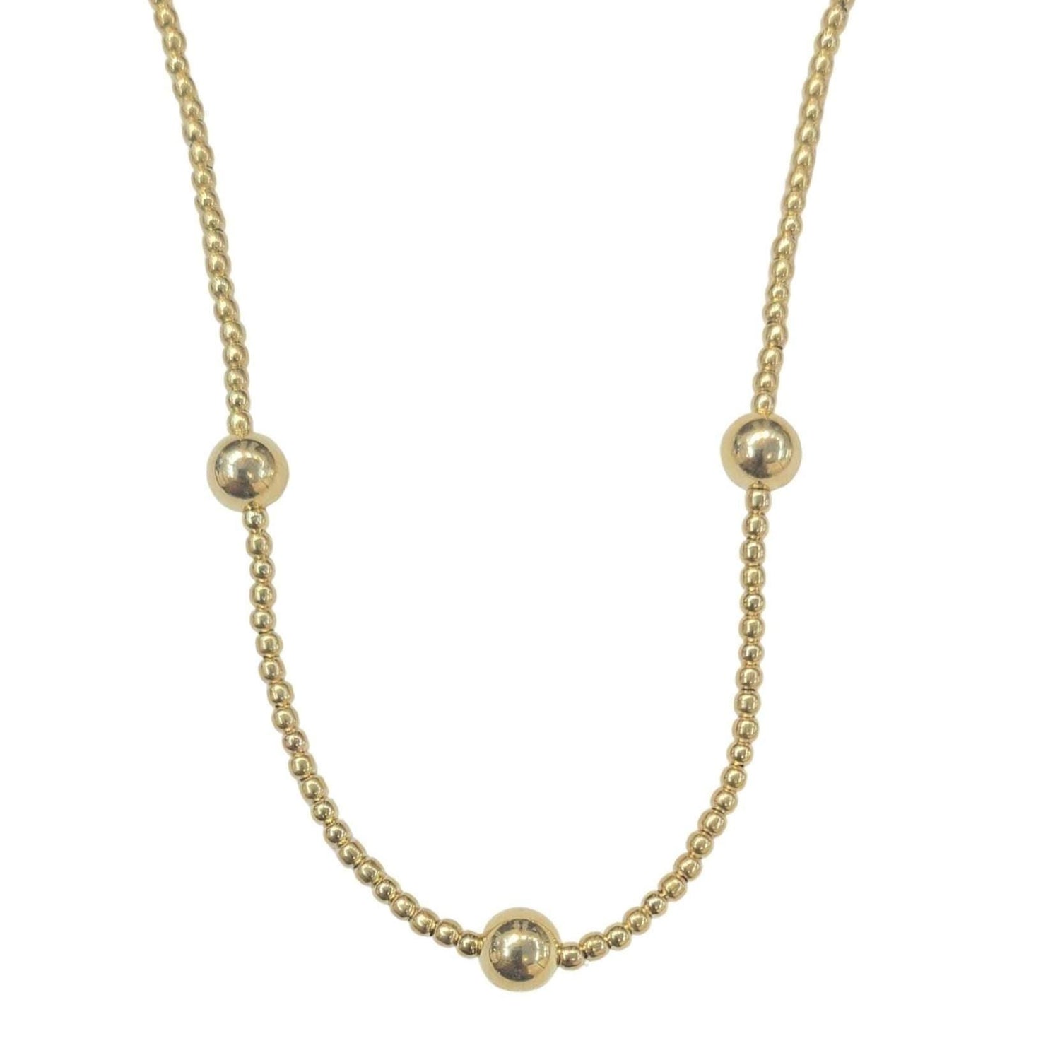 May include: A gold necklace with five round beads. The necklace is made of a delicate chain.