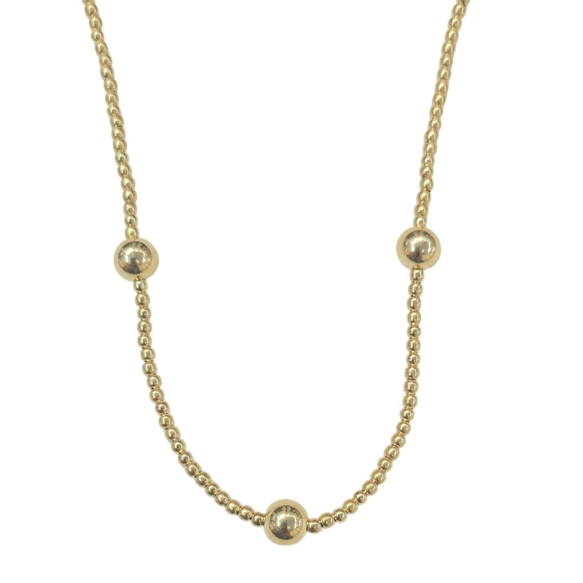 May include: A gold necklace with five round beads. The necklace is made of a delicate chain.