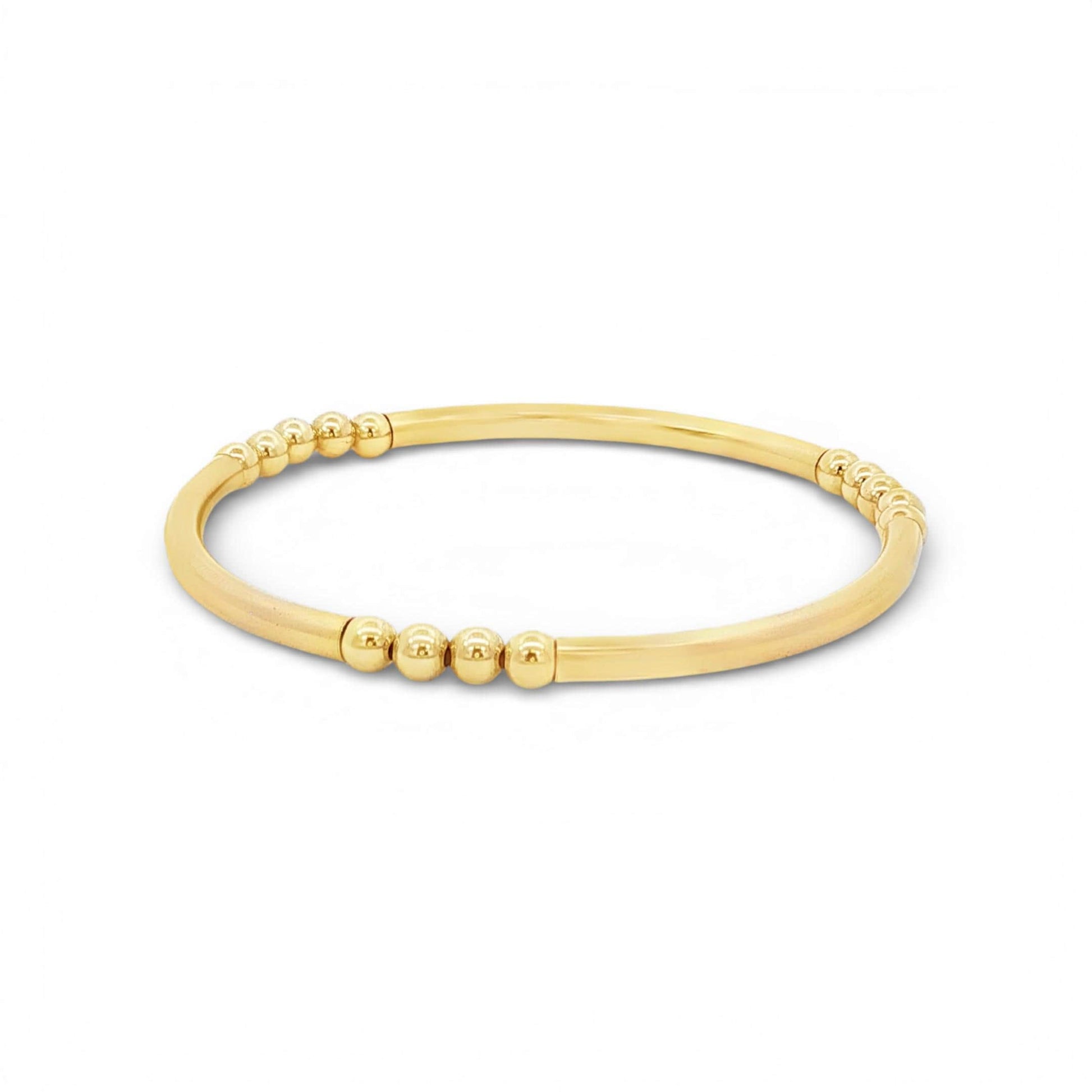 A gold-colored bracelet with a curved design and small, round beads along the edge.
